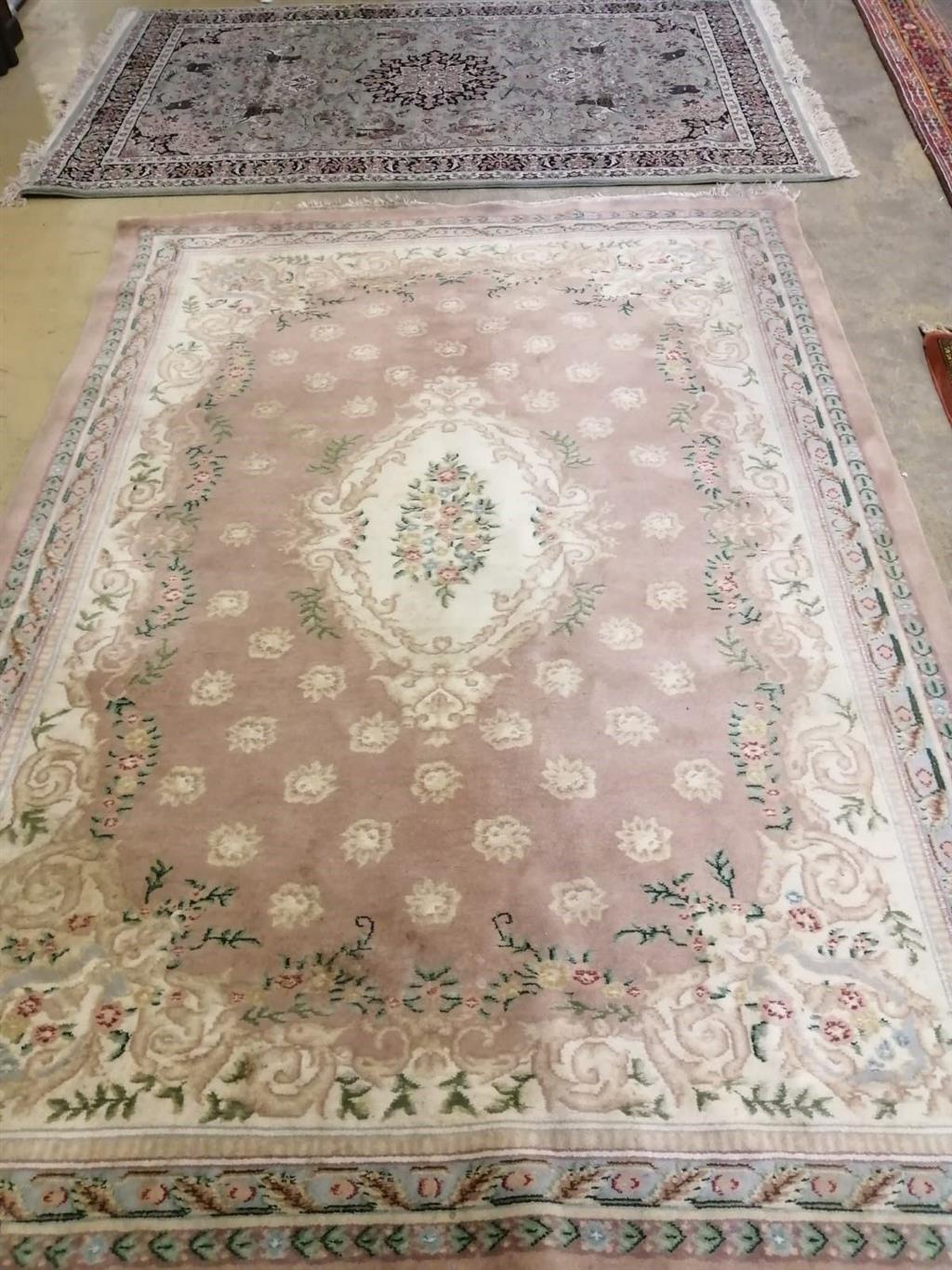 A Chinese style beige ground carpet, a Tabriz style green ground rug and a North West Persian style rug, largest 270 x 190cm